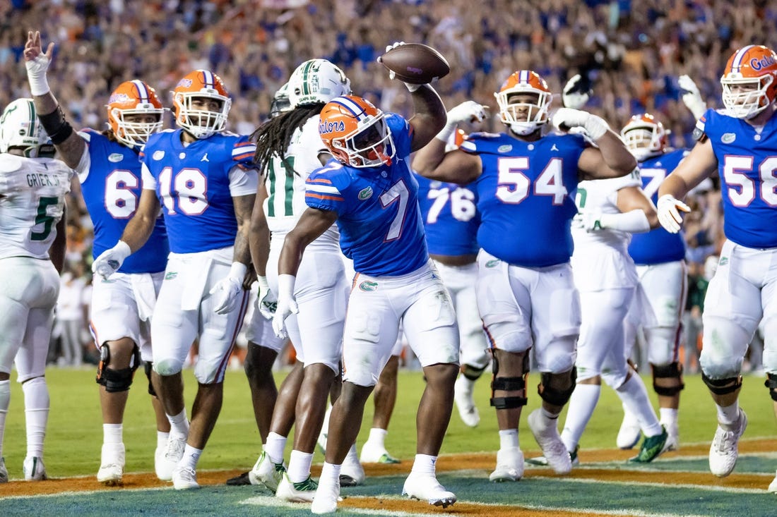 Trevor Etienne's late TD vaults No. 18 Florida over USF - Field Level ...