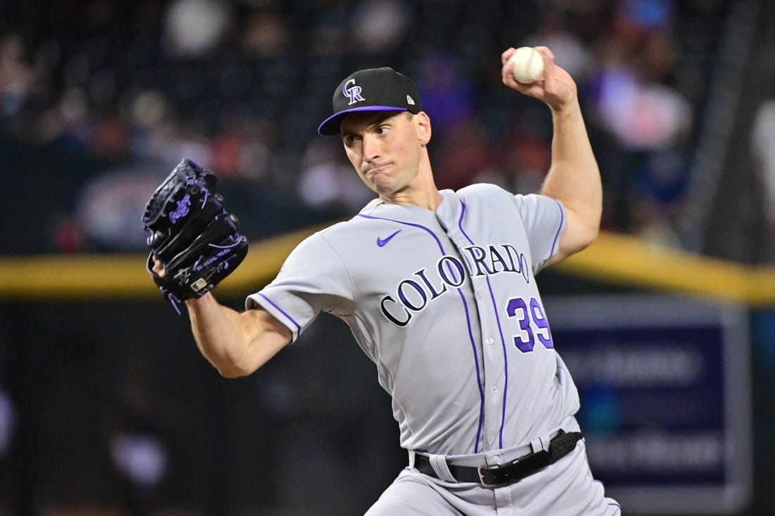 Colorado Rockies relief pitcher Brent Suter throws during a