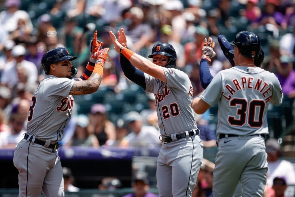 Javier Baez and Matt Vierling of the Detroit Tigers high-five to