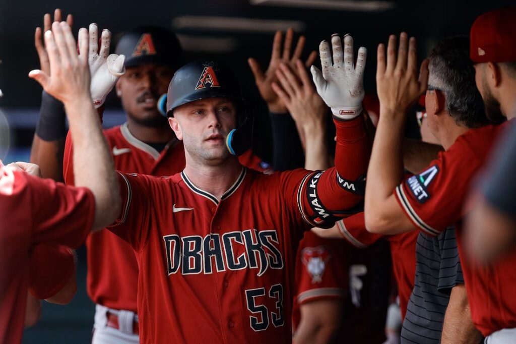 Carroll's 2-run triple in the 8th rallies Diamondbacks past