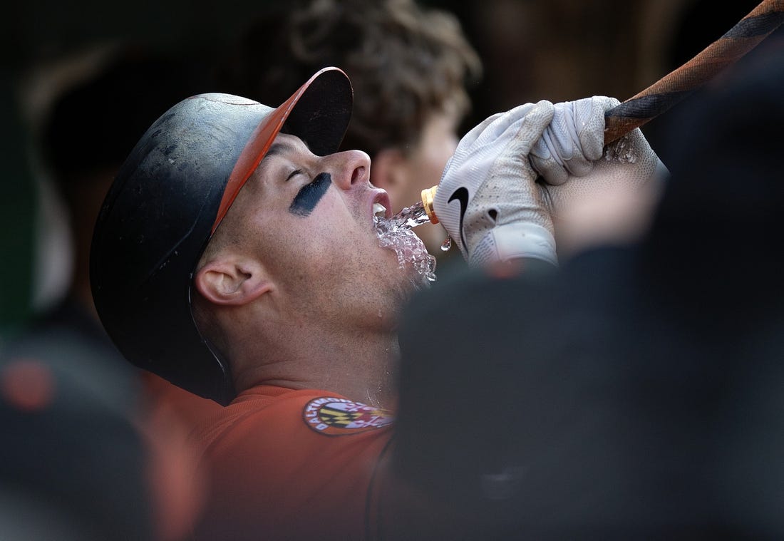 Shintaro Fujinami and James McCann of the Baltimore Orioles return