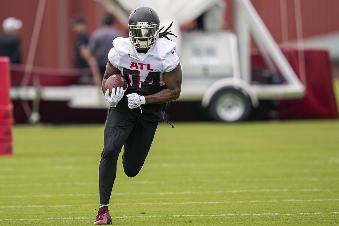 Atlanta Falcons quarterback Logan Woodside (11) works during the