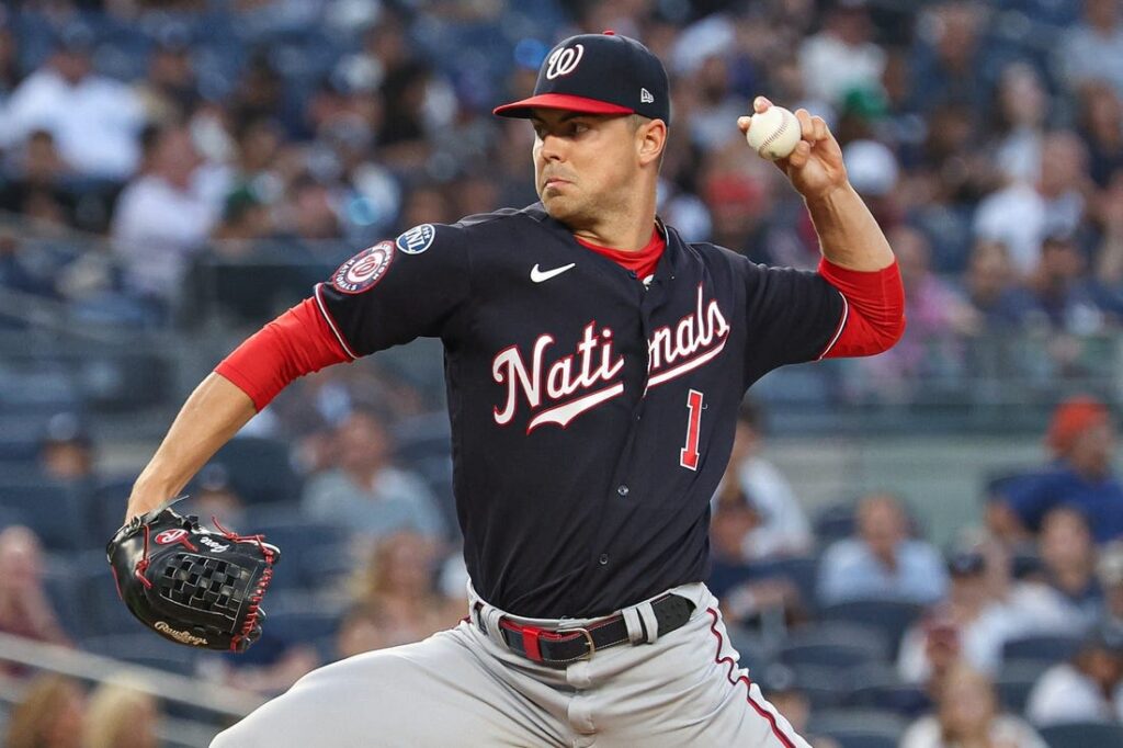 Dodgers endure long rain delay to earn win over Nats