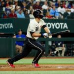 Dodgers endure long rain delay to earn win over Nats