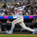 Dodgers endure long rain delay to earn win over Nats