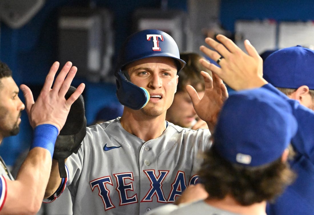 Texas Rangers' Travis Jankowski follows through on his RBI double