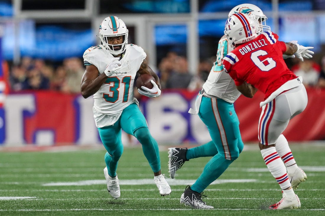 FOXBOROUGH, MA - JANUARY 01: Miami Dolphins running back Raheem Mostert  (31) on a carry during a game between the New England Patriots and the  Miami Dolphins on January 1, 2023, at