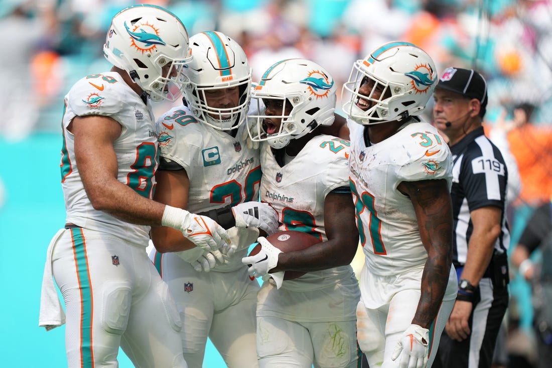 Miami Dolphins wide receiver Jaylen Waddle (17) is tackled by Buffalo Bills  cornerback Taron Johnson (7)