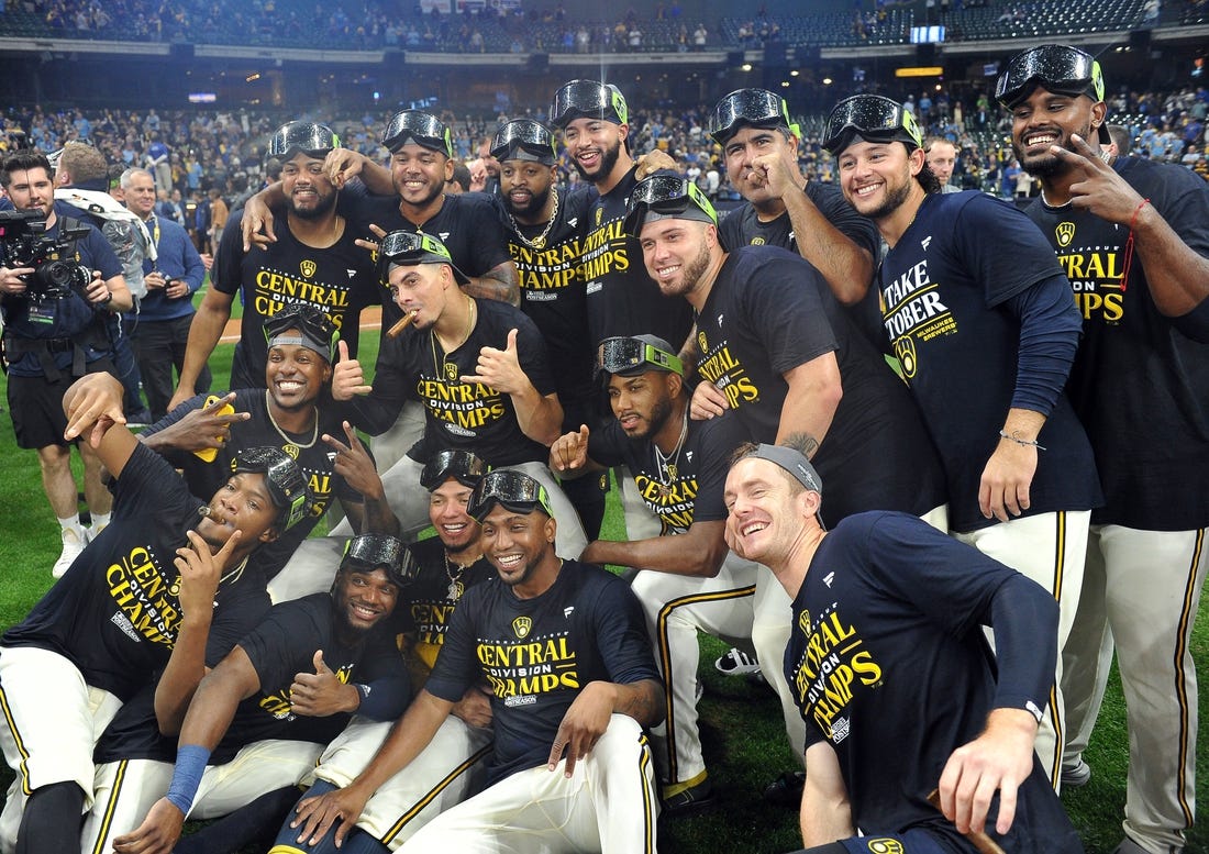 Brewers clinch playoff spot, close in on NL Central title with 12