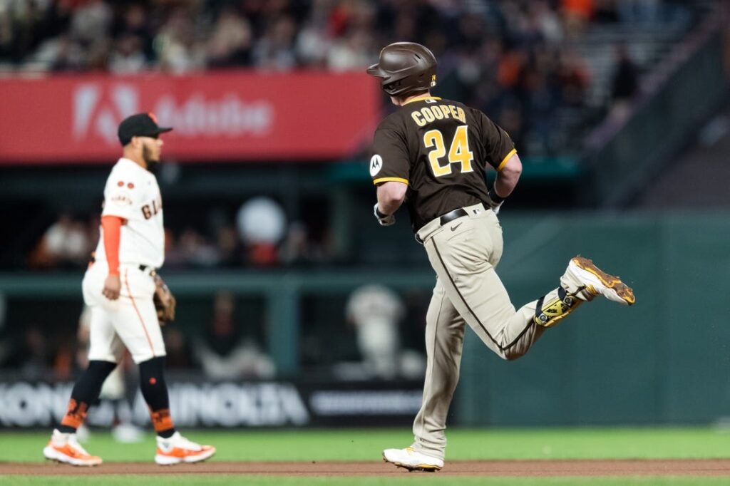 Padres keep playoff hopes alive, beat Giants 5-2 in 10th for first