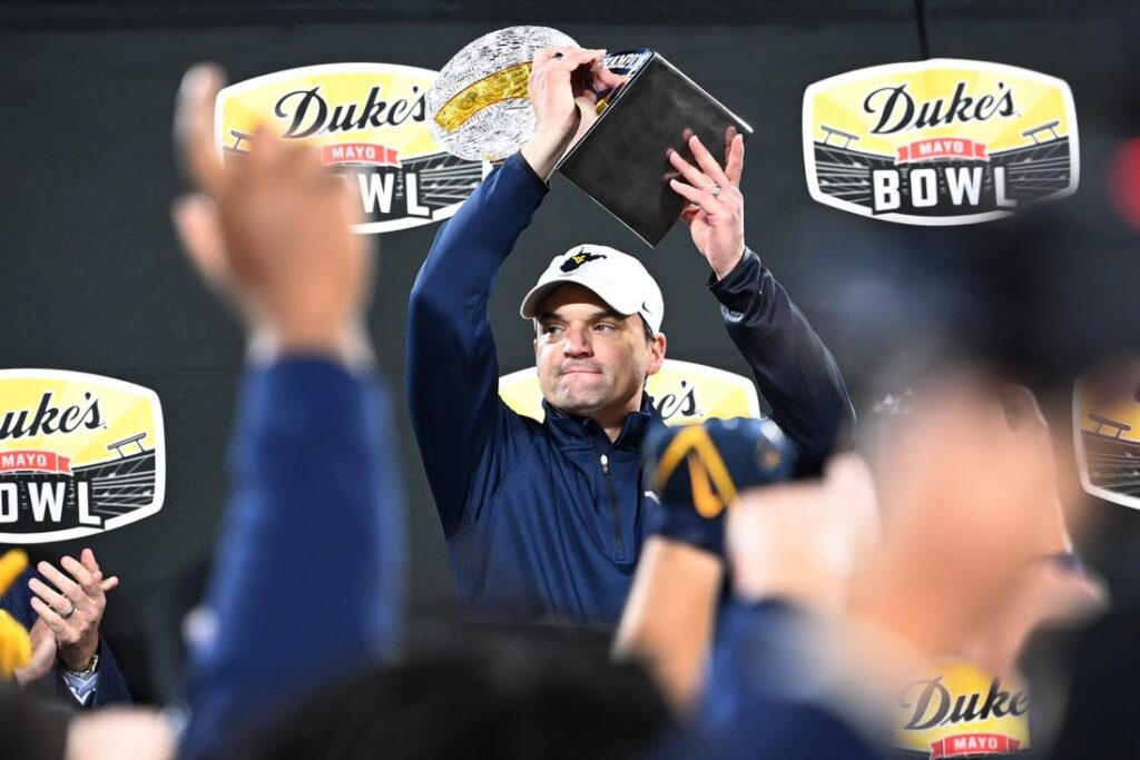 West Virginia Extends Coach Neal Brown's Contract Through 2027, Decreases Salary to Invest in Program