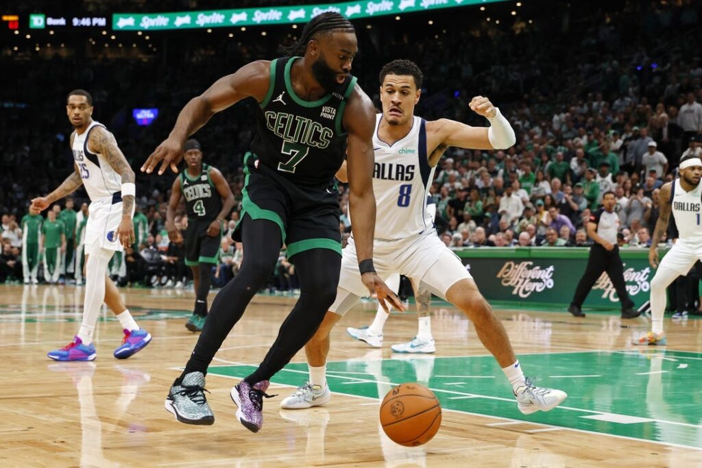 Jaylen Brown dribbles