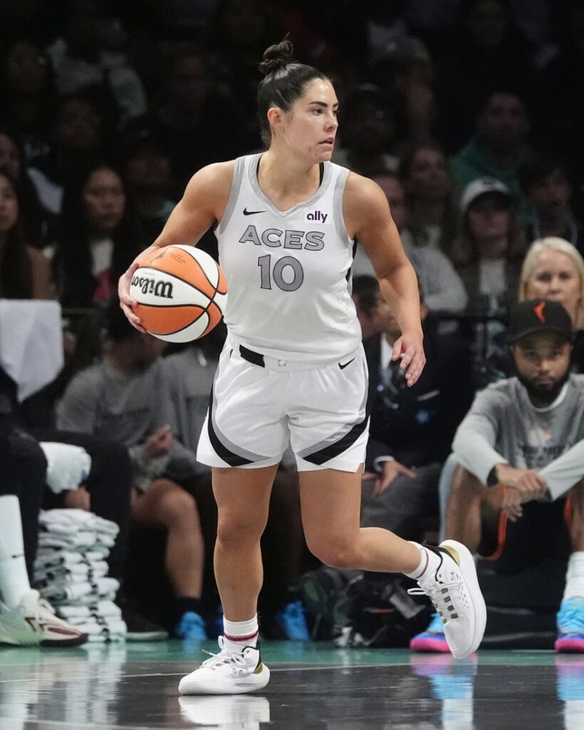 Kelsey Plum dribbles