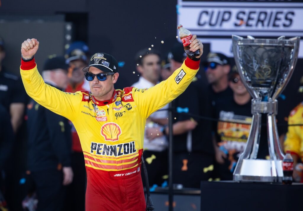 joey logano celebrates
