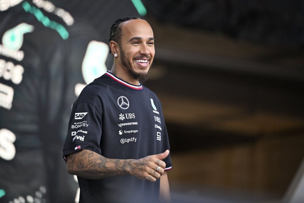 Lewis Hamilton smiles