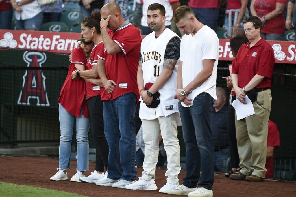 The family of Tyler Skaggs stands