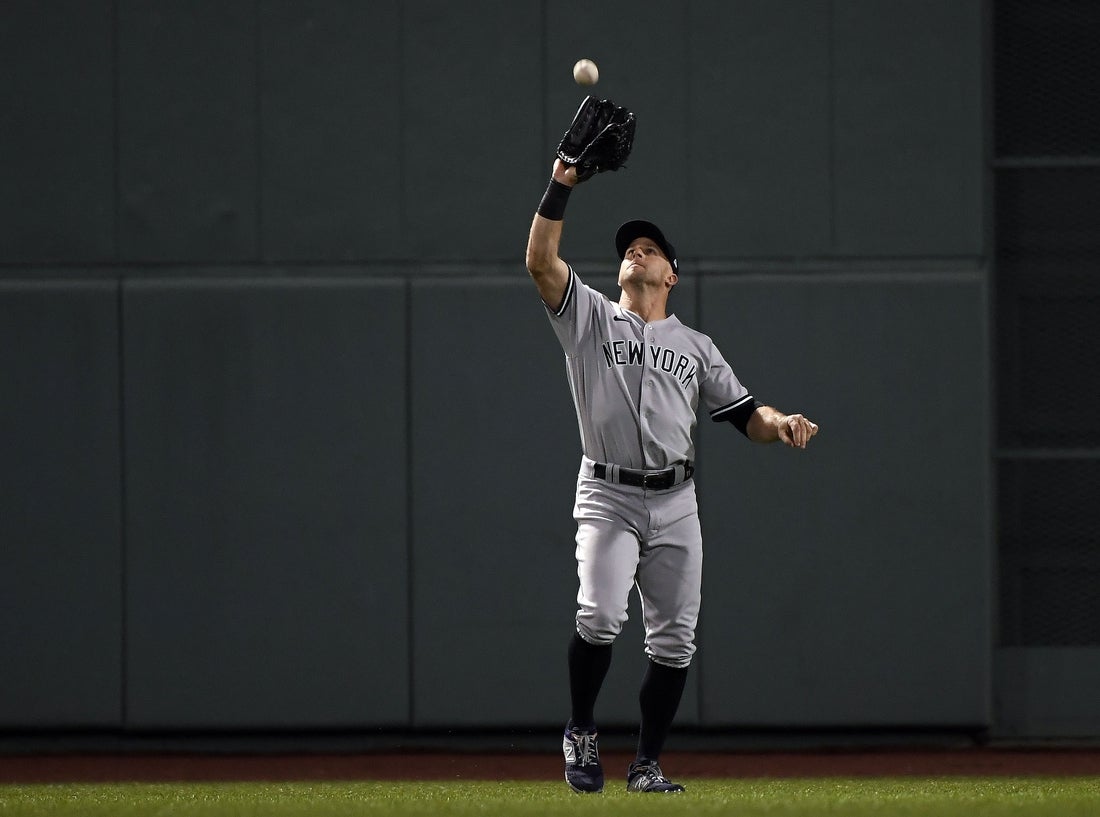 Oct 5, 2021; Boston, Massachusetts, USA; New York Yankees center fielder Brett Gardner (11) catches the fly ball hit by Boston Red Sox designated hitter Kyle Schwarber (18) during the first inning of the American League Wildcard game at Fenway Park. Mandatory Credit: Bob DeChiara-Imagn Images