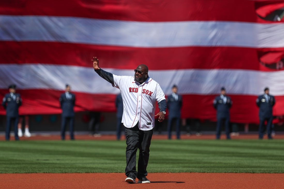 Apr 15, 2022; Boston, Massachusetts, USA; Former Boston Red Sox player Mo Vaughn (42) waves to the crowd at Fenway Park. Every player is wearing number 42 in honor of Jackie Robinson. Mandatory Credit: Paul Rutherford-Imagn Images