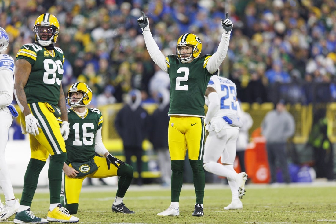 Jan 8, 2023; Green Bay, Wisconsin, USA; Green Bay Packers kicker Mason Crosby (2) celebrates after making a a field goal during the second quarter against the Detroit Lions at Lambeau Field. Mandatory Credit: Jeff Hanisch-Imagn Images
