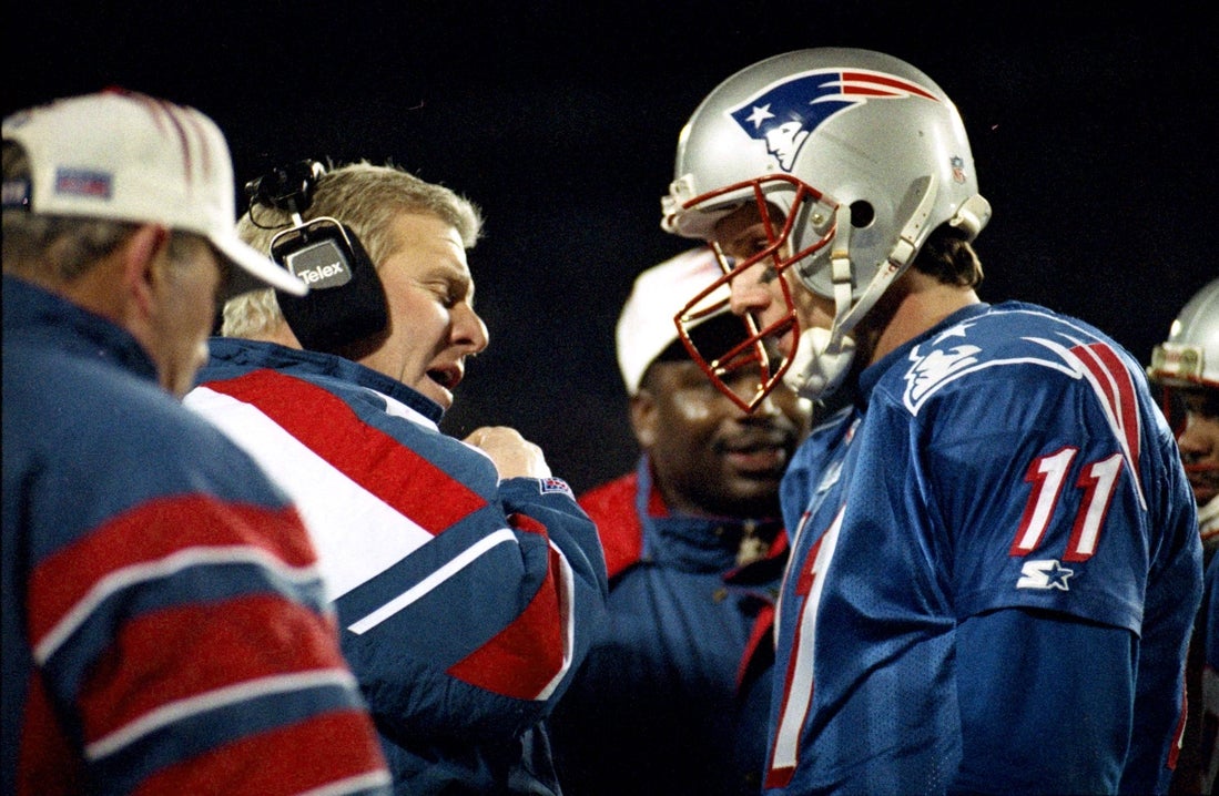 ORG XMIT: Patriots head coach Bill Parcells confers on the sideline with quarterback Drew Bledsoe during the game. Pats vs. Jacksonville Jaguars, 1/12/97. Journal photo by Glenn Osmundson. Old Pats 2