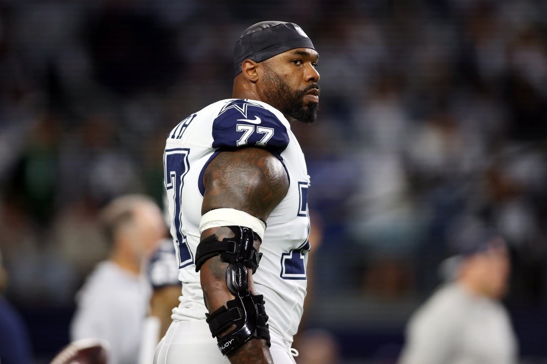 Dec 10, 2023; Arlington, Texas, USA; Dallas Cowboys offensive tackle Tyron Smith (77) on the field before the game against the Philadelphia Eagles at AT&T Stadium. Mandatory Credit: Tim Heitman-Imagn Images