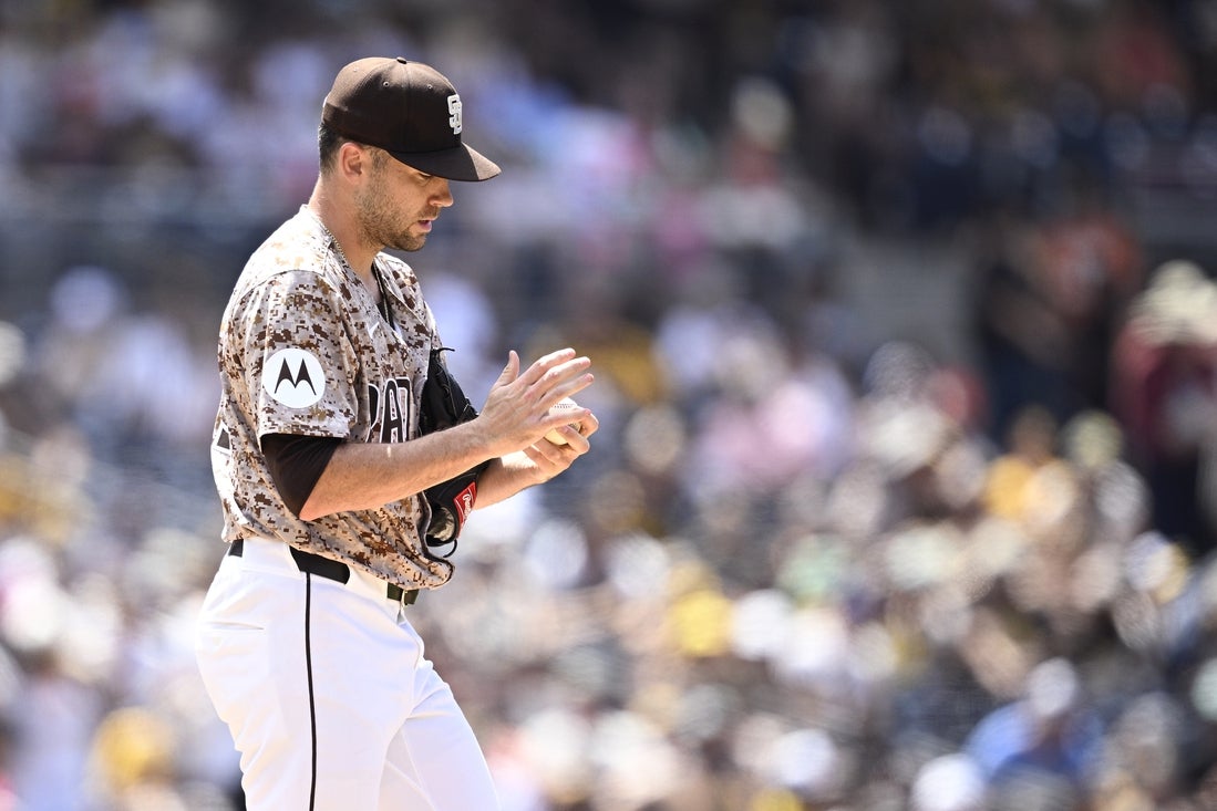Jun 23, 2024; San Diego, California, USA; San Diego Padres relief pitcher Tom Cosgrove (59) prepares to pitch against the Milwaukee Brewers during the seventh inning at Petco Park. Mandatory Credit: Orlando Ramirez-Imagn Images