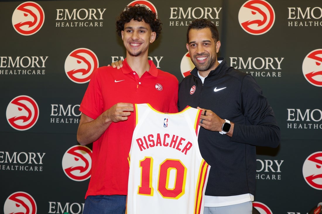 Jun 28, 2024; Atlanta, Georgia, USA; Atlanta Hawks first overall draft pick Zaccharie Risacher poses for a photo with general manager Landry Fields at the Emory Sports Medicine Complex. Mandatory Credit: Brett Davis-Imagn Images