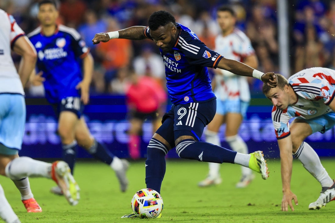 Jul 17, 2024; Cincinnati, Ohio, USA; FC Cincinnati forward Aaron Boupendza (9) kicks the ball against the Chicago Fire in the second half at TQL Stadium. Mandatory Credit: Katie Stratman-Imagn Images