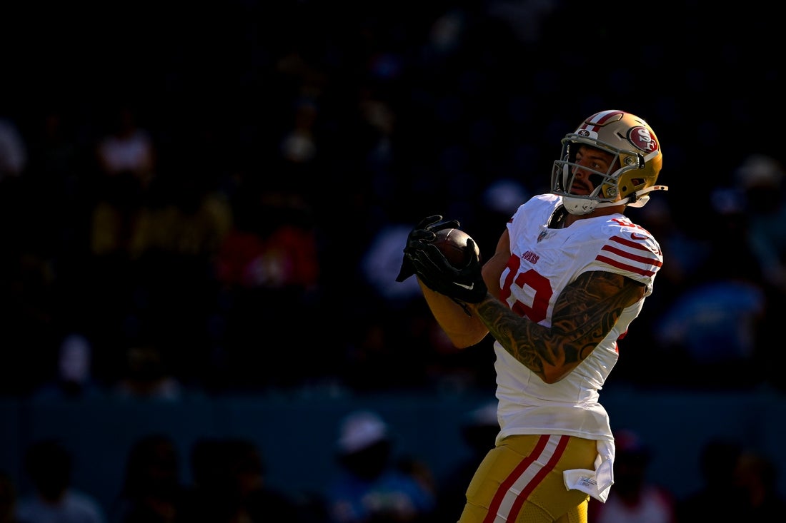 Aug 10, 2024; Nashville, Tennessee, USA; San Francisco 49ers tight end Eric Saubert (82) makes a catch against the Tennessee Titans during pregame warmups at Nissan Stadium. Mandatory Credit: Steve Roberts-Imagn Images