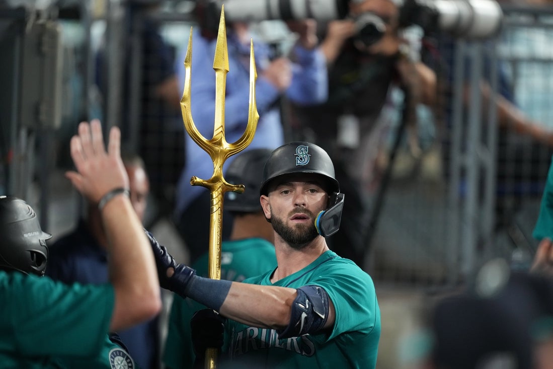 Aug 21, 2024; Los Angeles, California, USA; Seattle Mariners right fielder Mitch Haniger (17) holds a pitchfork after hitting a home run in the ninth inning against the Los Angeles Dodgers at Dodger Stadium. Mandatory Credit: Kirby Lee-Imagn Images