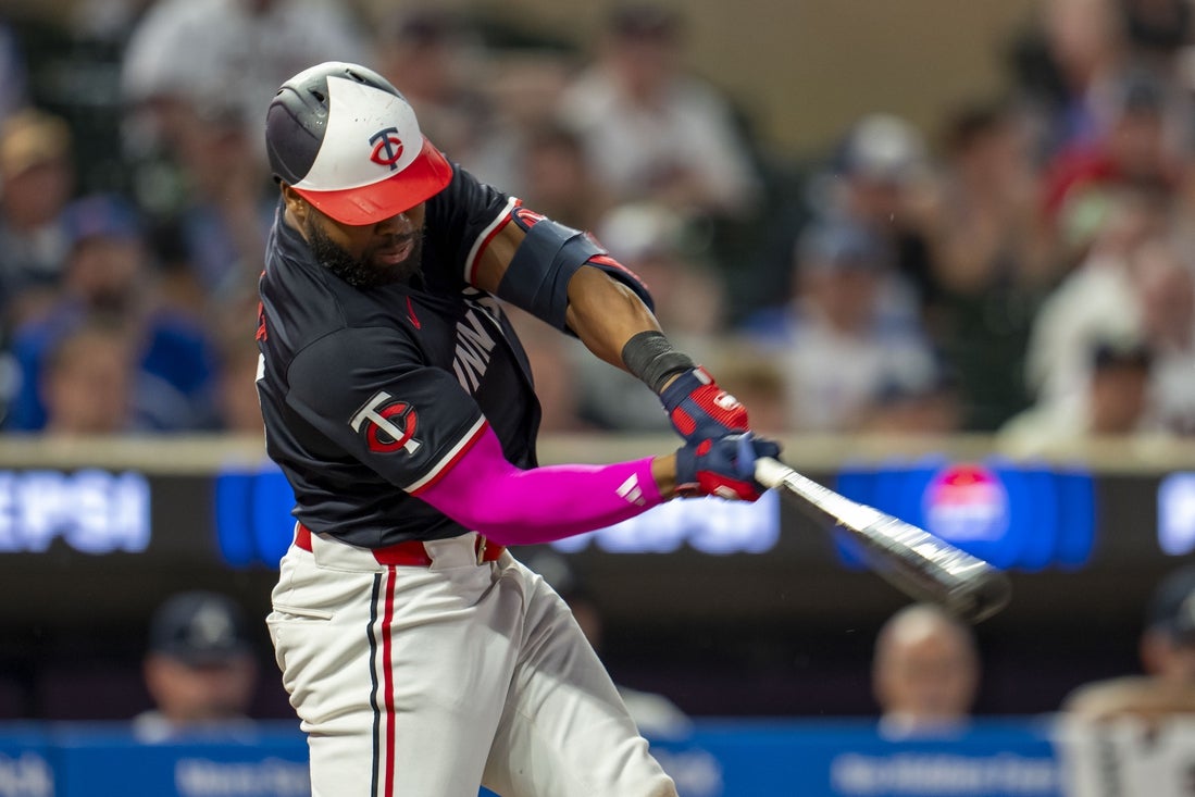 Aug 26, 2024; Minneapolis, Minnesota, USA; Minnesota Twins left fielder Manuel Margot (13) hits a RBI single against the Atlanta Braves in the fifth inning at Target Field. Mandatory Credit: Jesse Johnson-Imagn Images