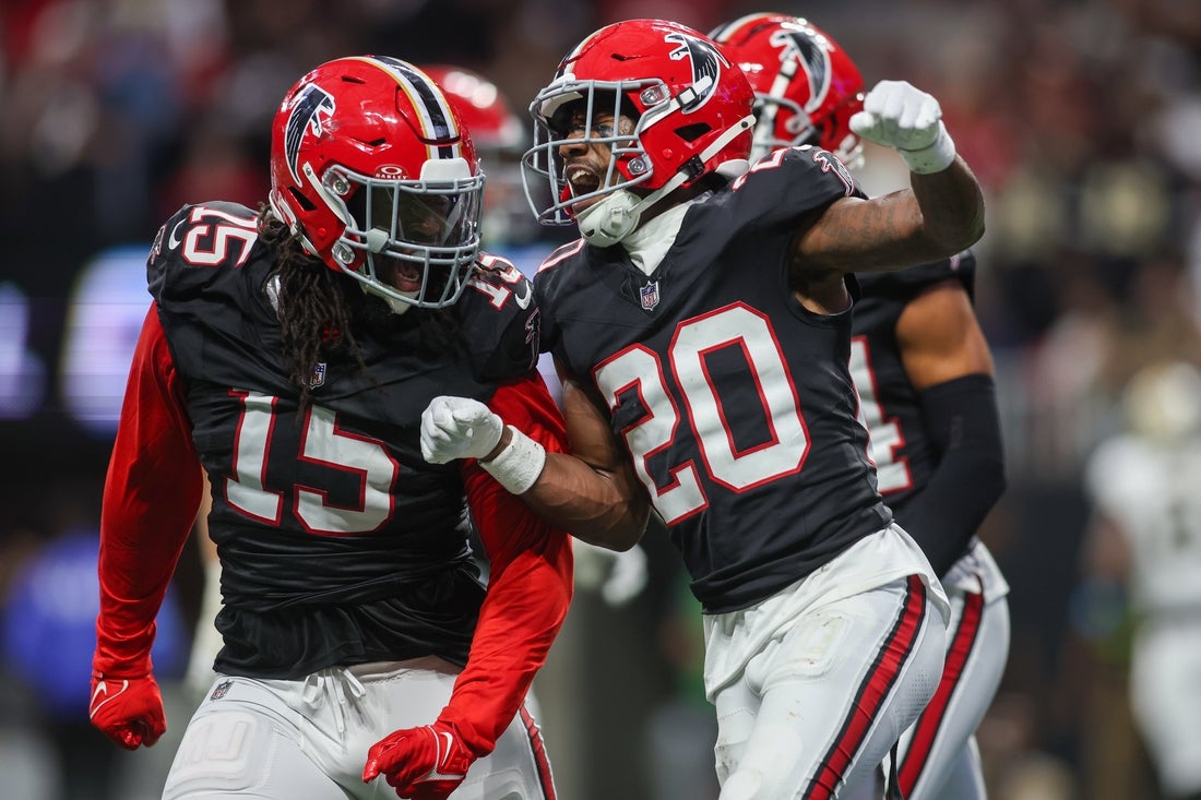 Sep 29, 2024; Atlanta, Georgia, USA; Atlanta Falcons linebacker Matthew Judon (15) and cornerback Dee Alford (20) celebrate after a turnover on downs against the New Orleans Saints in the fourth quarter at Mercedes-Benz Stadium. Mandatory Credit: Brett Davis-Imagn Images