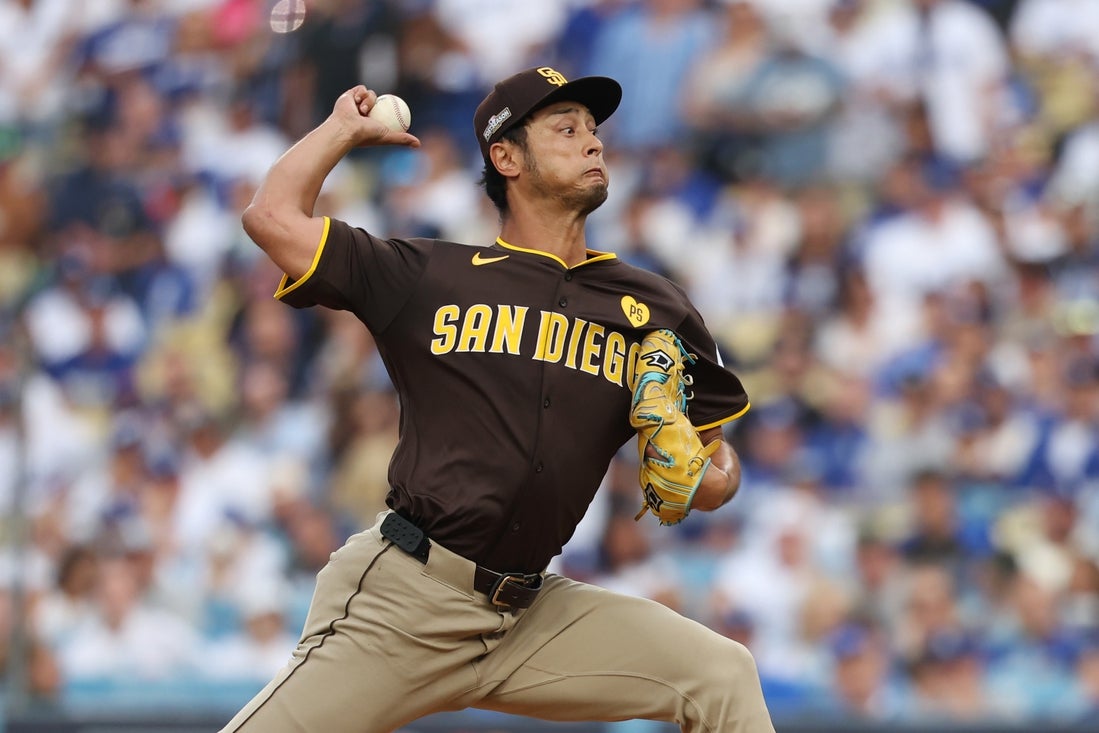 Oct 11, 2024; Los Angeles, California, USA; San Diego Padres pitcher Yu Darvish (11) pitches against the Los Angeles Dodgers in the first inning during game five of the NLDS for the 2024 MLB Playoffs at Dodger Stadium. Mandatory Credit: Kiyoshi Mio-Imagn Images