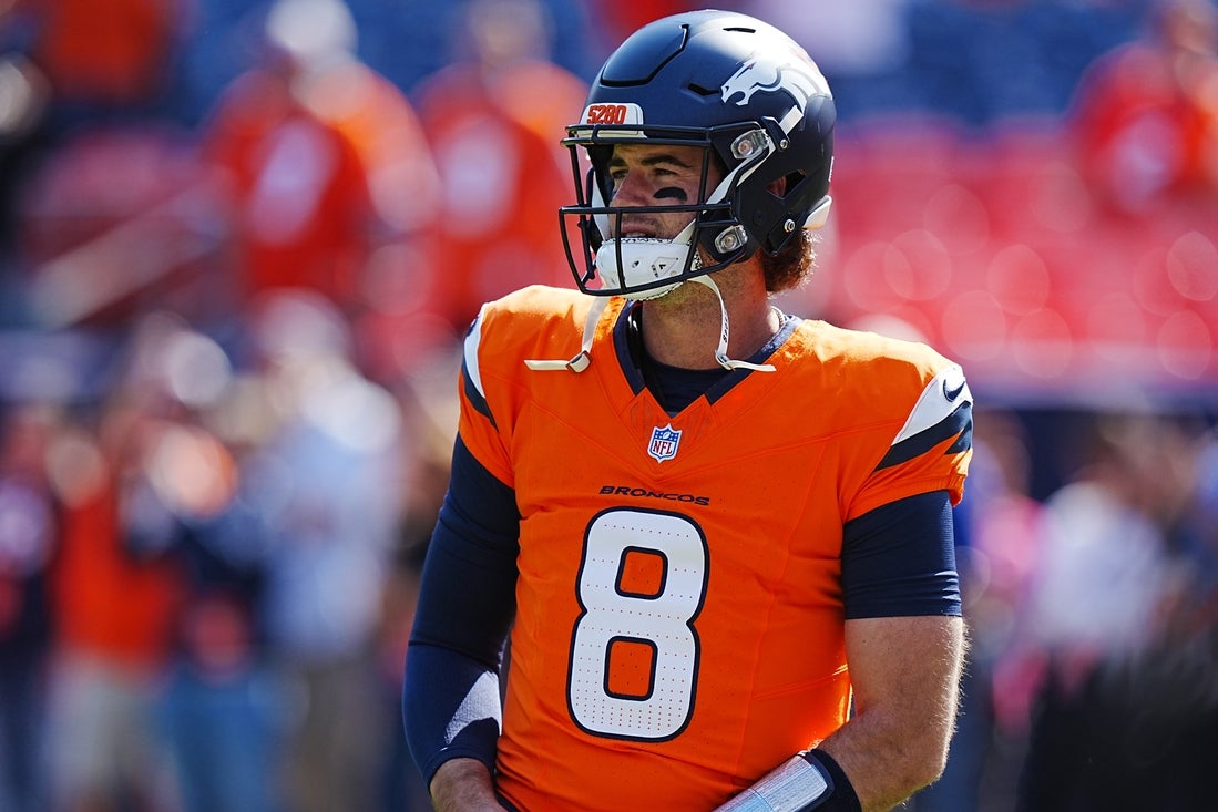 Oct 13, 2024; Denver, Colorado, USA; Denver Broncos quarterback Jarrett Stidham (8) warms up before the game against the Los Angeles Chargers at Empower Field at Mile High. Mandatory Credit: Ron Chenoy-Imagn Images