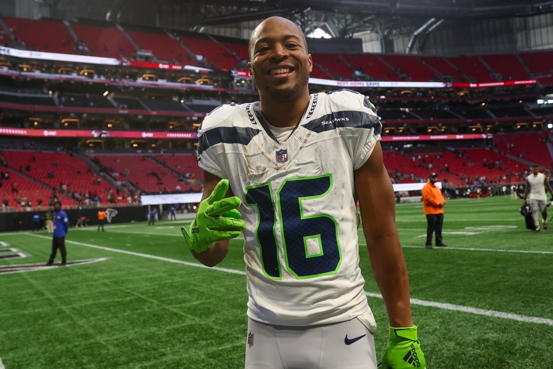 Oct 20, 2024; Atlanta, Georgia, USA; Seattle Seahawks wide receiver Tyler Lockett (16) celebrates after a victory over the Atlanta Falcons at Mercedes-Benz Stadium. Mandatory Credit: Brett Davis-Imagn Images