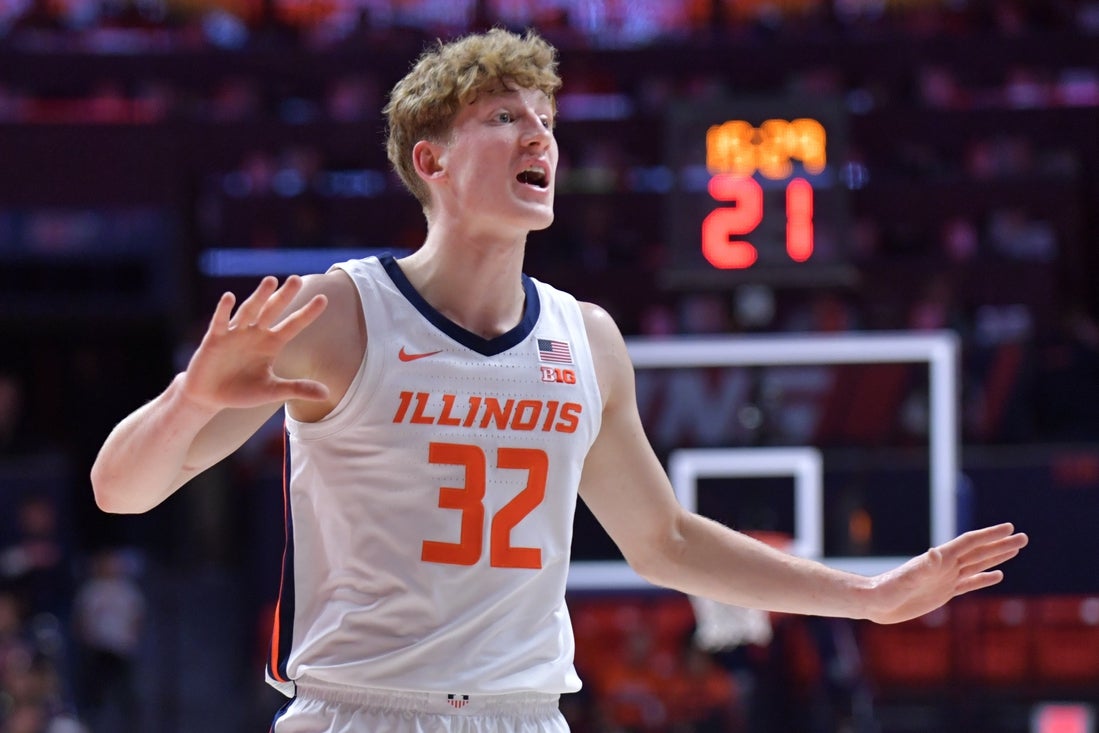 Nov 13, 2024; Champaign, Illinois, USA; Illinois Fighting Illini guard Kasparas Jakucionis (32) reacts during the first half against the Oakland Golden Grizzlies at State Farm Center. Mandatory Credit: Ron Johnson-Imagn Images