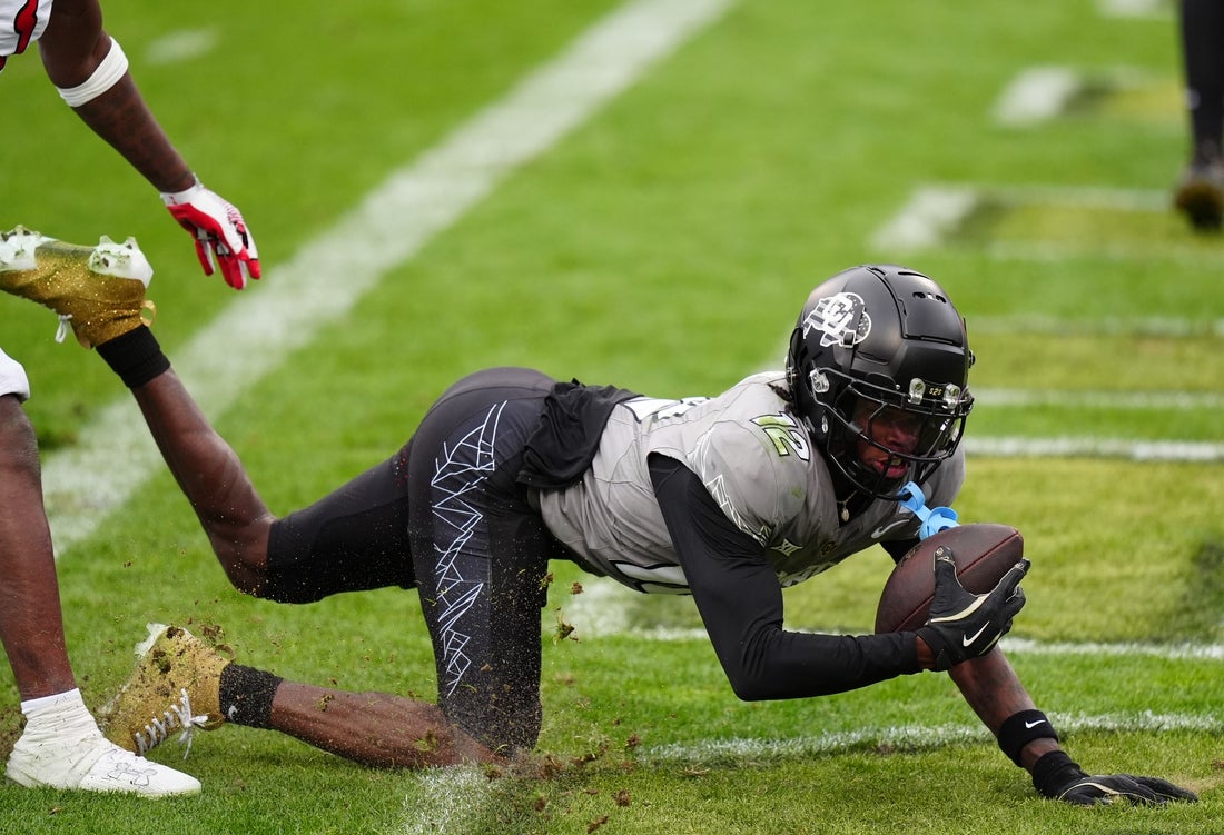 Colorado Buffaloes wide receiver Travis Hunter (12) scores a touchdown in the fourth quarter against the Utah Utes at Folsom Field. Mandatory Credit: Ron Chenoy-Imagn Images