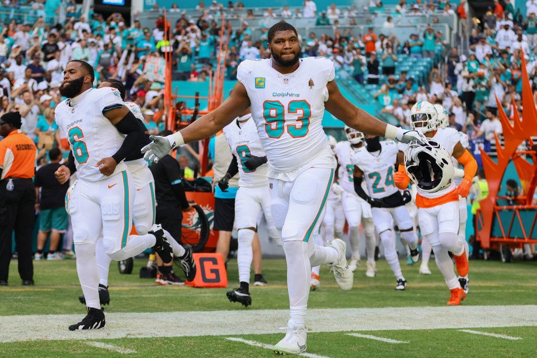 Nov 24, 2024; Miami Gardens, Florida, USA; Miami Dolphins defensive end Calais Campbell (93) runs to the field before the game against the New England Patriots at Hard Rock Stadium. Mandatory Credit: Sam Navarro-Imagn Images