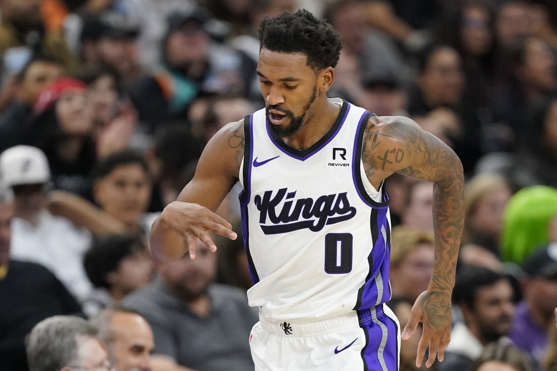 Dec 6, 2024; San Antonio, Texas, USA; Sacramento Kings guard Malik Monk (0) reacts after scoring a three pointer during the first half against the San Antonio Spurs at Frost Bank Center. Mandatory Credit: Scott Wachter-Imagn Images