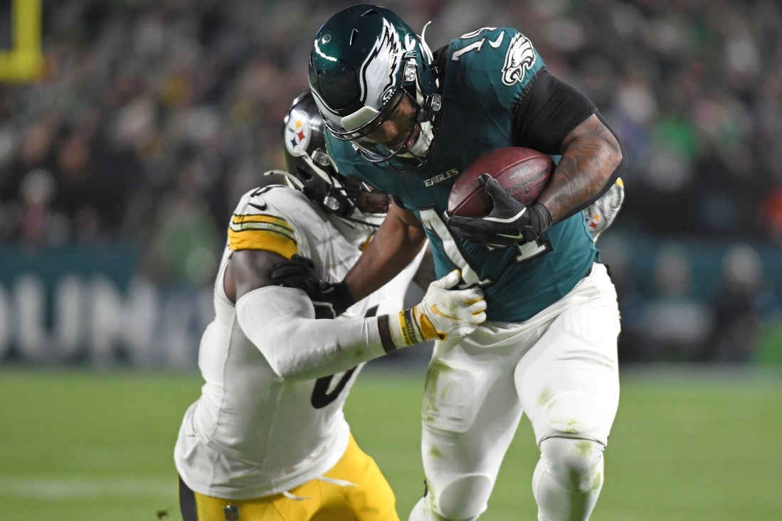 Dec 15, 2024; Philadelphia, Pennsylvania, USA; Philadelphia Eagles running back Kenneth Gainwell (14) is tackled by Pittsburgh Steelers linebacker Patrick Queen (6) during the third quarter at Lincoln Financial Field. Mandatory Credit: Eric Hartline-Imagn Images