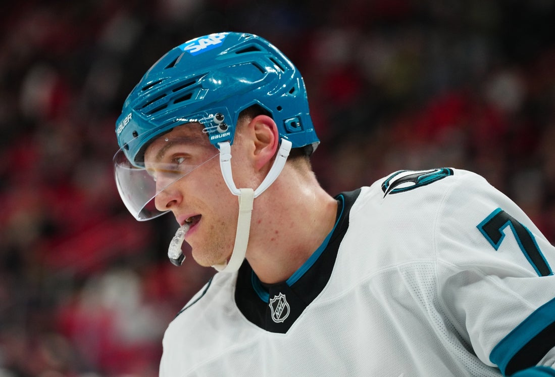 Dec 10, 2024; Raleigh, North Carolina, USA; San Jose Sharks center Nico Sturm (7) looks on against the Carolina Hurricanes during the first period at Lenovo Center. Mandatory Credit: James Guillory-Imagn Images