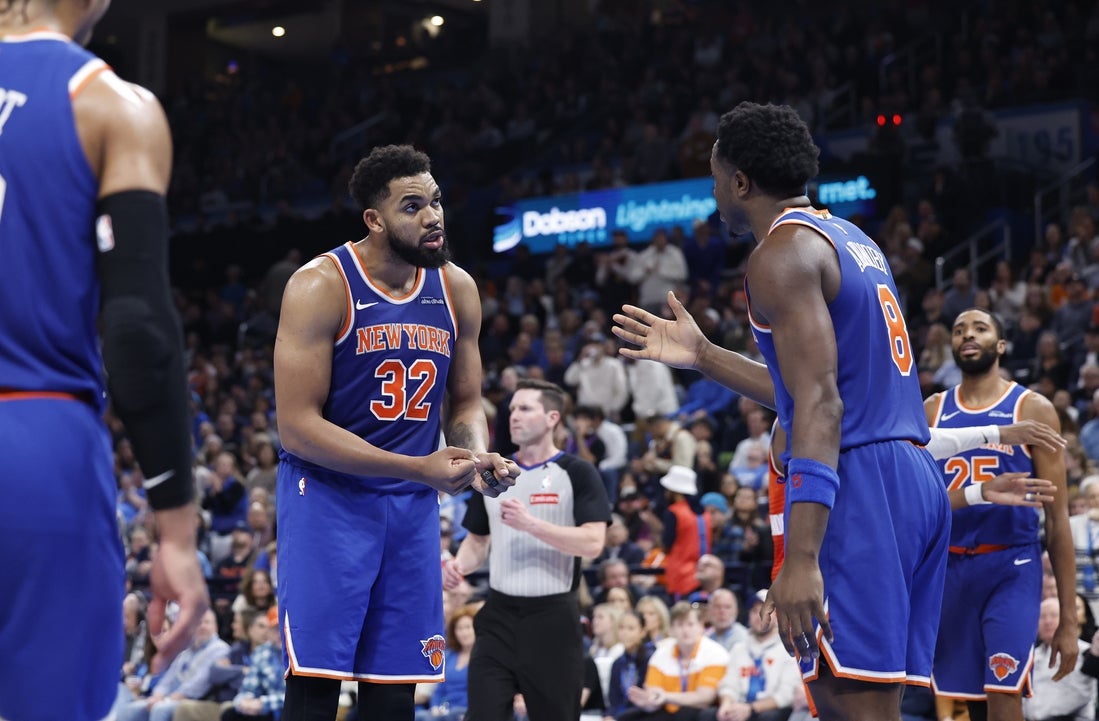 Jan 3, 2025; Oklahoma City, Oklahoma, USA; New York Knicks center Karl-Anthony Towns (32) talks with forward OG Anunoby (8) after a play against the Oklahoma City Thunder during the second half at Paycom Center. Mandatory Credit: Alonzo Adams-Imagn Images