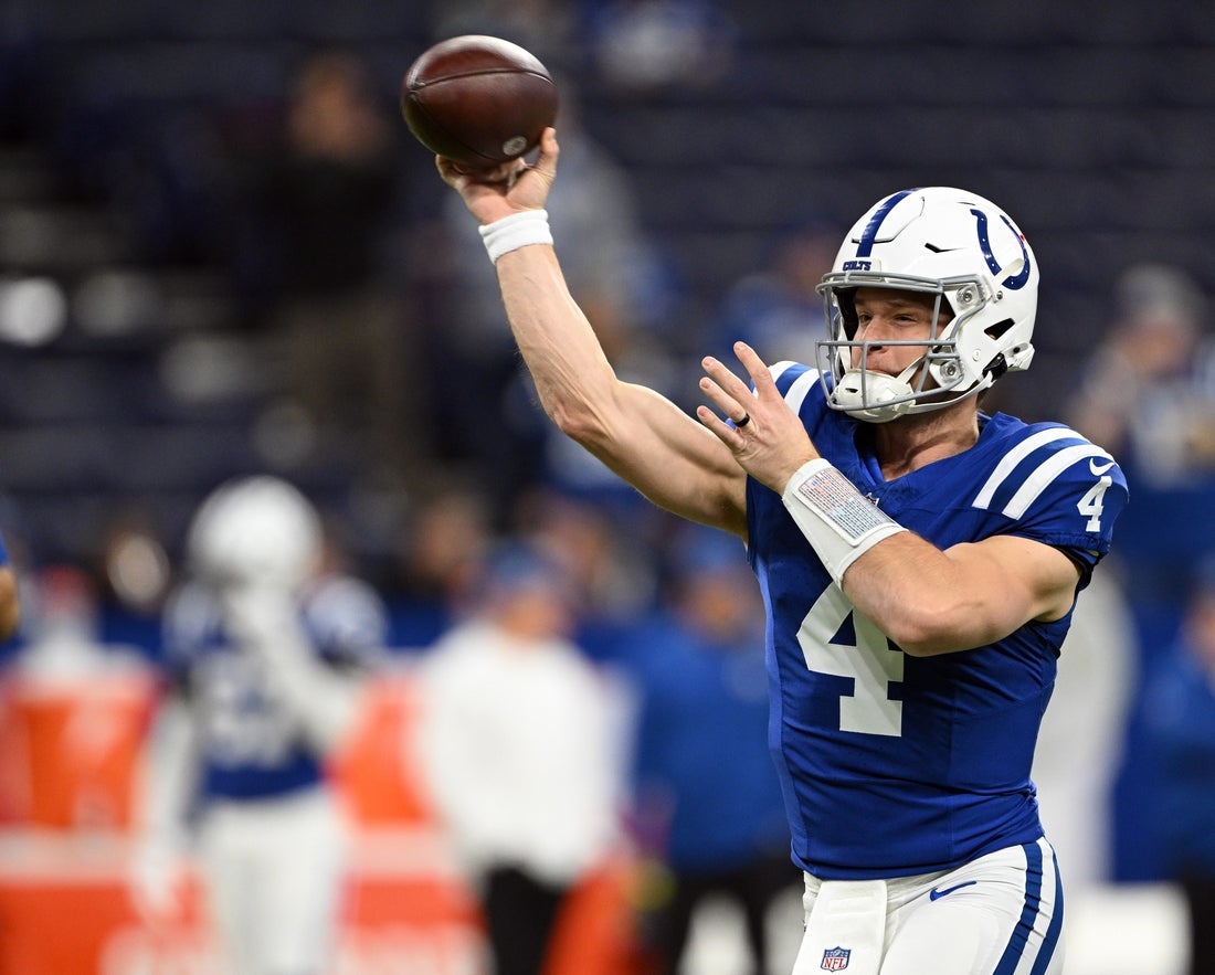 Jan 5, 2025; Indianapolis, Indiana, USA; Indianapolis Colts quarterback Sam Ehlinger (4) throws a pass to warm up before the game against the Jacksonville Jaguars at Lucas Oil Stadium. Mandatory Credit: Marc Lebryk-Imagn Images