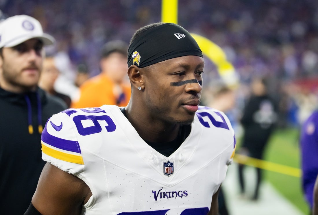 Jan 13, 2025; Glendale, AZ, USA; Minnesota Vikings safety Theo Jackson (26) against the Los Angeles Rams during an NFC wild card game at State Farm Stadium. Mandatory Credit: Mark J. Rebilas-Imagn Images