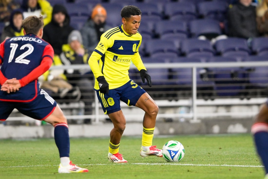 Feb 22, 2025; Nashville, Tennessee, USA; Nashville SC midfielder Ahmed Qasem (37) dribbles the ball against the New England Revolution during the second half at Geodis Park. Mandatory Credit: Steve Roberts-Imagn Images