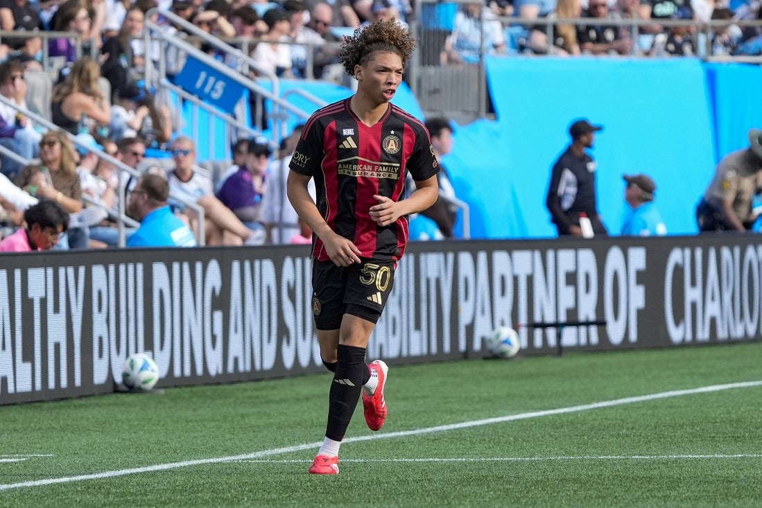 Mar 1, 2025; Charlotte, North Carolina, USA; Atlanta United defender Dominik Chong Qui (50) makes his way down field against Charlotte FC during the second half at Bank of America Stadium. Mandatory Credit: Jim Dedmon-Imagn Images