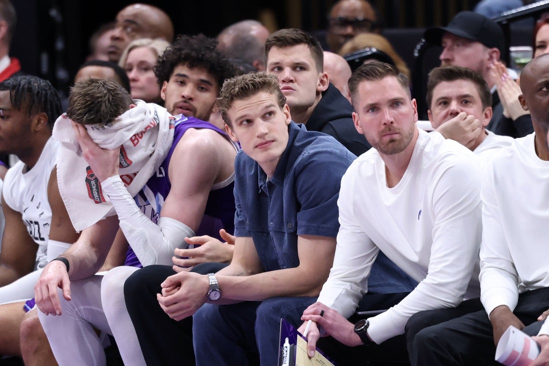 Mar 2, 2025; Salt Lake City, Utah, USA; Utah Jazz forward Lauri Markkanen (center) looks on from the bench during the second half of the game against the New Orleans Pelicans at Delta Center. Mandatory Credit: Rob Gray-Imagn Images