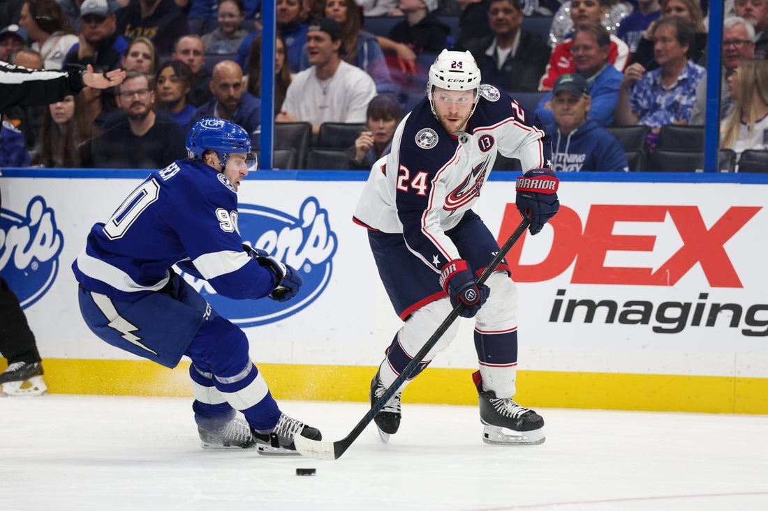 Mar 4, 2025; Tampa, Florida, USA; Columbus Blue Jackets right wing Mathieu Olivier (24) controls the puck against the Tampa Bay Lightning in the first period at Amalie Arena. Mandatory Credit: Nathan Ray Seebeck-Imagn Images