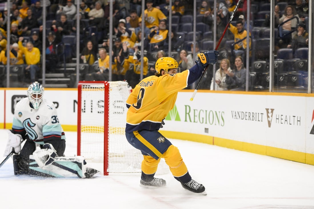 Mar 6, 2025; Nashville, Tennessee, USA; Nashville Predators left wing Filip Forsberg (9) celebrates his goal against the Seattle Krakenduring the first period at Bridgestone Arena. Mandatory Credit: Steve Roberts-Imagn Images