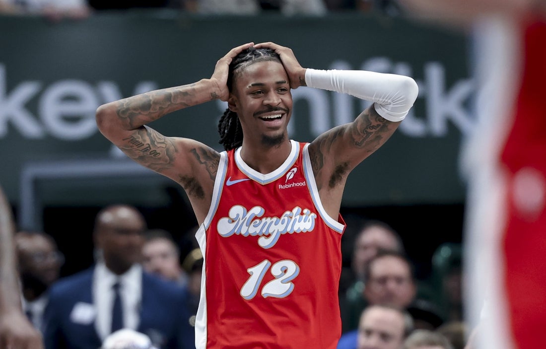 Mar 7, 2025; Dallas, Texas, USA; Memphis Grizzlies guard Ja Morant (12) reacts against the Dallas Mavericks during the second half at American Airlines Center. Mandatory Credit: Kevin Jairaj-Imagn Images